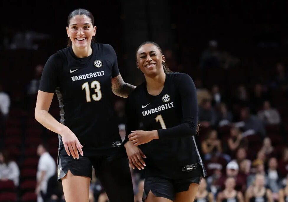 Two Vanderbilt women's basketball players smiling